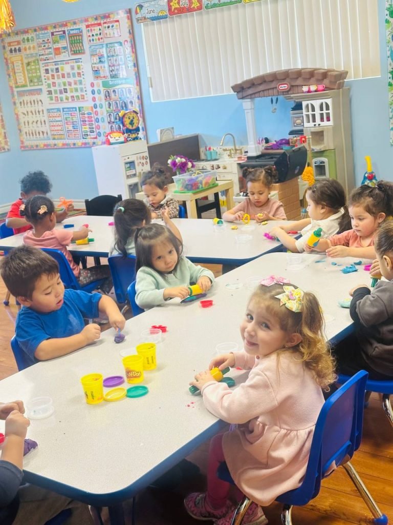 The children are sitting at their desks