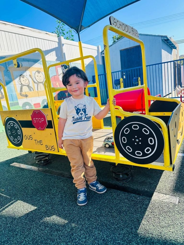 a child near the amusement rides